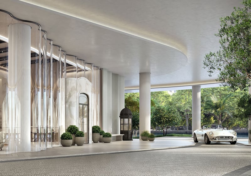 Baccarat Residences in Brickell, Miami, luxury and ultra luxury condos featuring a porte cochere arrival canopy, a curved drop-off drive, grand glass entry, landscaping, and a classic car.