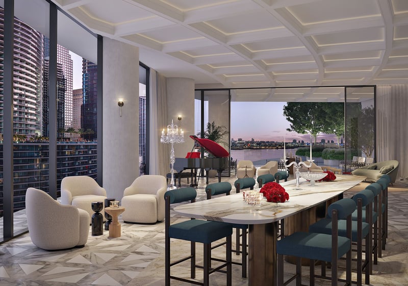 Baccarat Residences in Brickell, Miami, luxury and ultra luxury condos featuring a private dining salon, grand piano, a long entertaining table, marble flooring, and bay views.