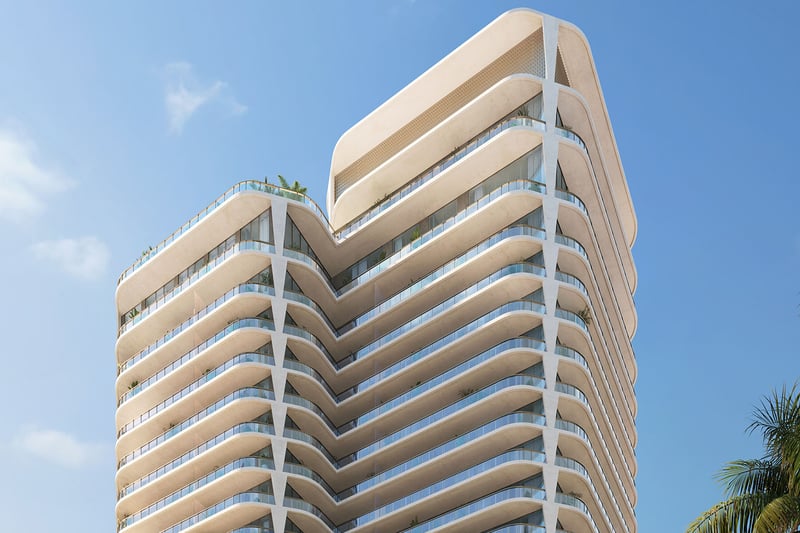 Curved corner exterior with layered balconies rising against a blue sky at Banyan Tree Residences in West Palm Beach, presenting luxury and ultra luxury condos with a sculptural modern waterfront tower design.