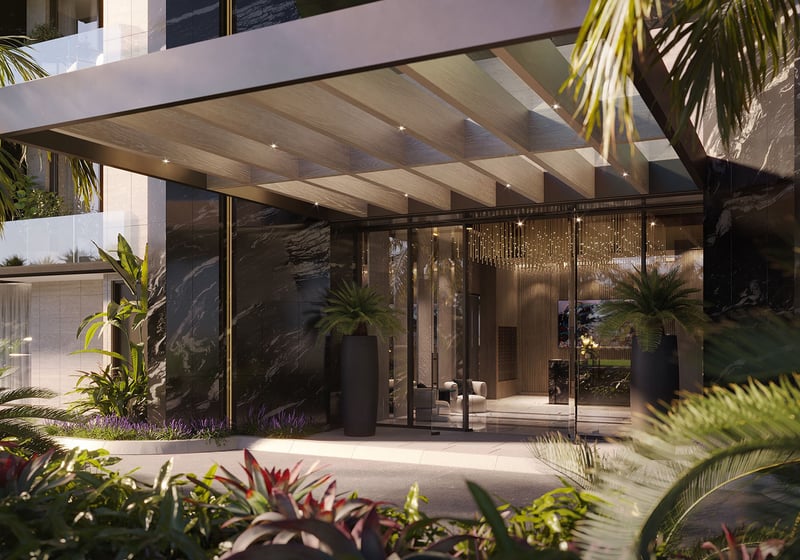 Bay Harbor Towers Bay Harbor Islands, Florida porte-cochere entrance with marble façade, glass doors, wood ceiling and lush landscaping, highlighting luxury and ultra luxury preconstruction condos arrival experience.