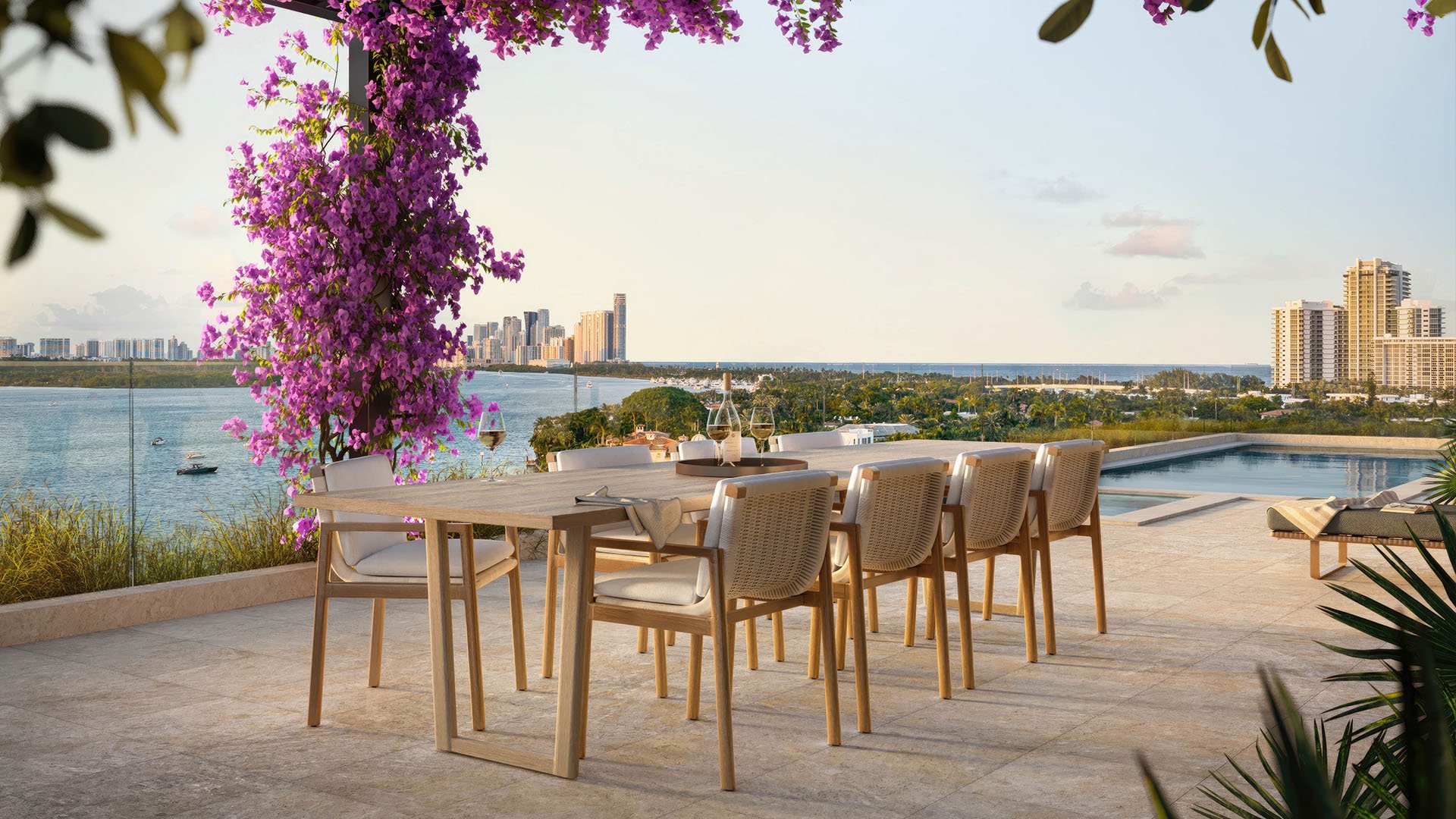 Bay Harbor Towers Bay Harbor Islands rooftop dining terrace beside infinity pool, bougainvillea trellis and panoramic bay-to-skyline views, showcasing luxury and ultra luxury preconstruction condos in Miami.