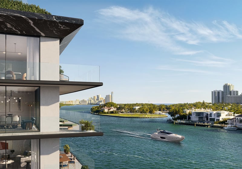 Bay Harbor Towers Bay Harbor Islands Miami corner balcony with floor-to-ceiling glass and panoramic Intracoastal views as a yacht cruises by, showcasing luxury and ultra luxury preconstruction condos lifestyle near Miami Beach.
