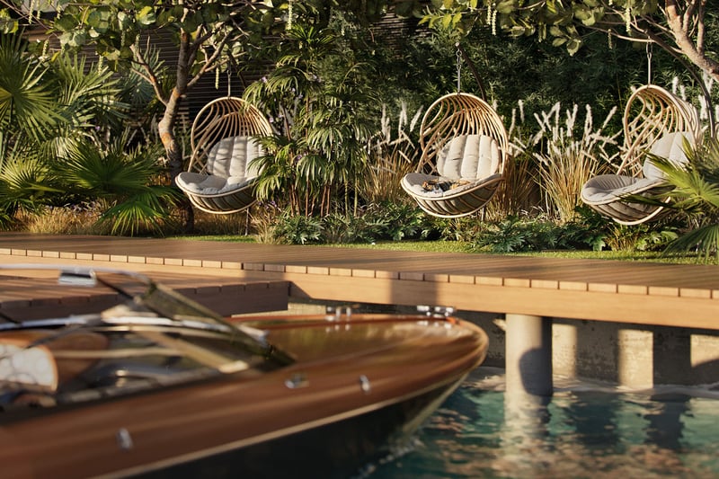 Bay Harbor Towers Bay Harbor Islands Miami waterfront deck with hanging lounge chairs, lush tropical landscaping, and a docked boat, highlighting luxury and ultra luxury preconstruction condos with private marina lifestyle.