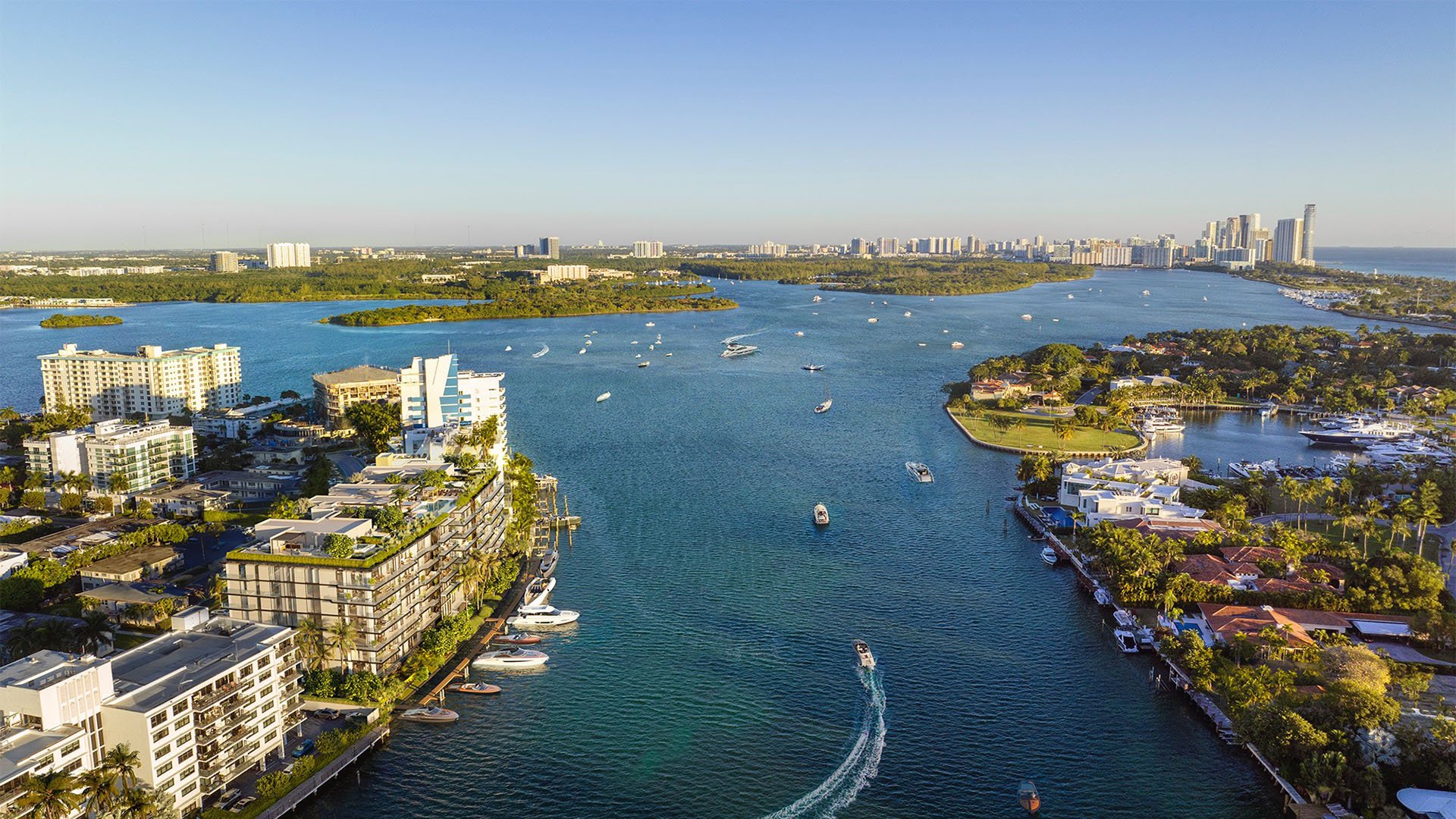 Aerial view of Bay Harbor Towers Bay Harbor Islands Miami on the Intracoastal Waterway, showcasing luxury and ultra luxury preconstruction condos with boats, islands, and sweeping waterfront skyline vistas.