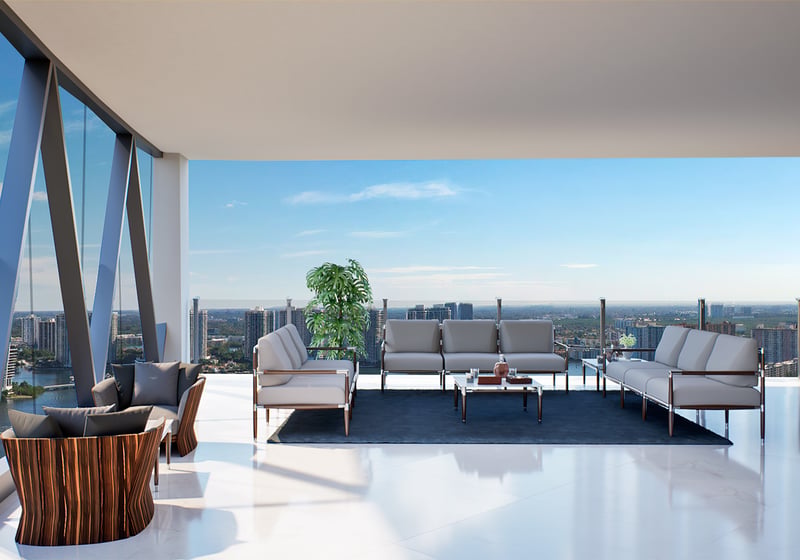 Bentley Residences Sunny Isles balcony lounge with city view in Sunny Isles Beach; luxury and ultra luxury condos, preconstruction, outdoor living.