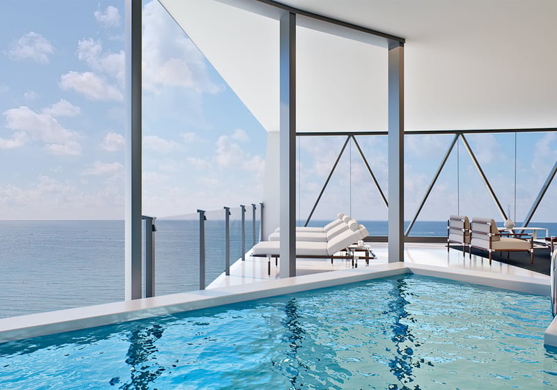 Bentley Residences Sunny Isles infinity pool with ocean view in Sunny Isles Beach; luxury and ultra luxury condos, preconstruction, resort deck.