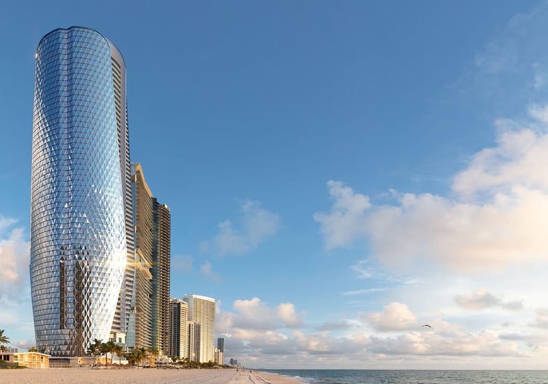 Bentley Residences Sunny Isles beachfront skyscraper at sunset in Sunny Isles Beach; luxury and ultra luxury condos, preconstruction, dramatic skyline. Featuring modern.