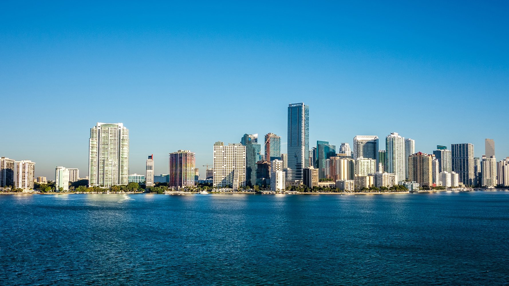 Daytime view of the Brickell, Miami skyline and bay, home to luxury and ultra luxury condos, with preconstruction and resale listings.