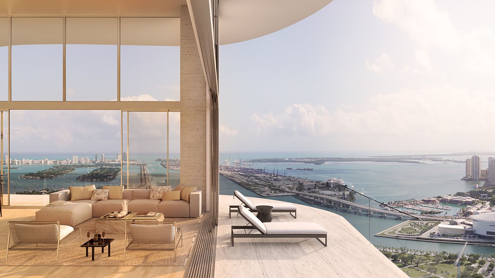 Casa Bella Downtown Miami luxury living room opening to curved balcony loungers with expansive Biscayne Bay views, highlighting ultra luxury preconstruction condos with indoor-outdoor coastal lifestyle.