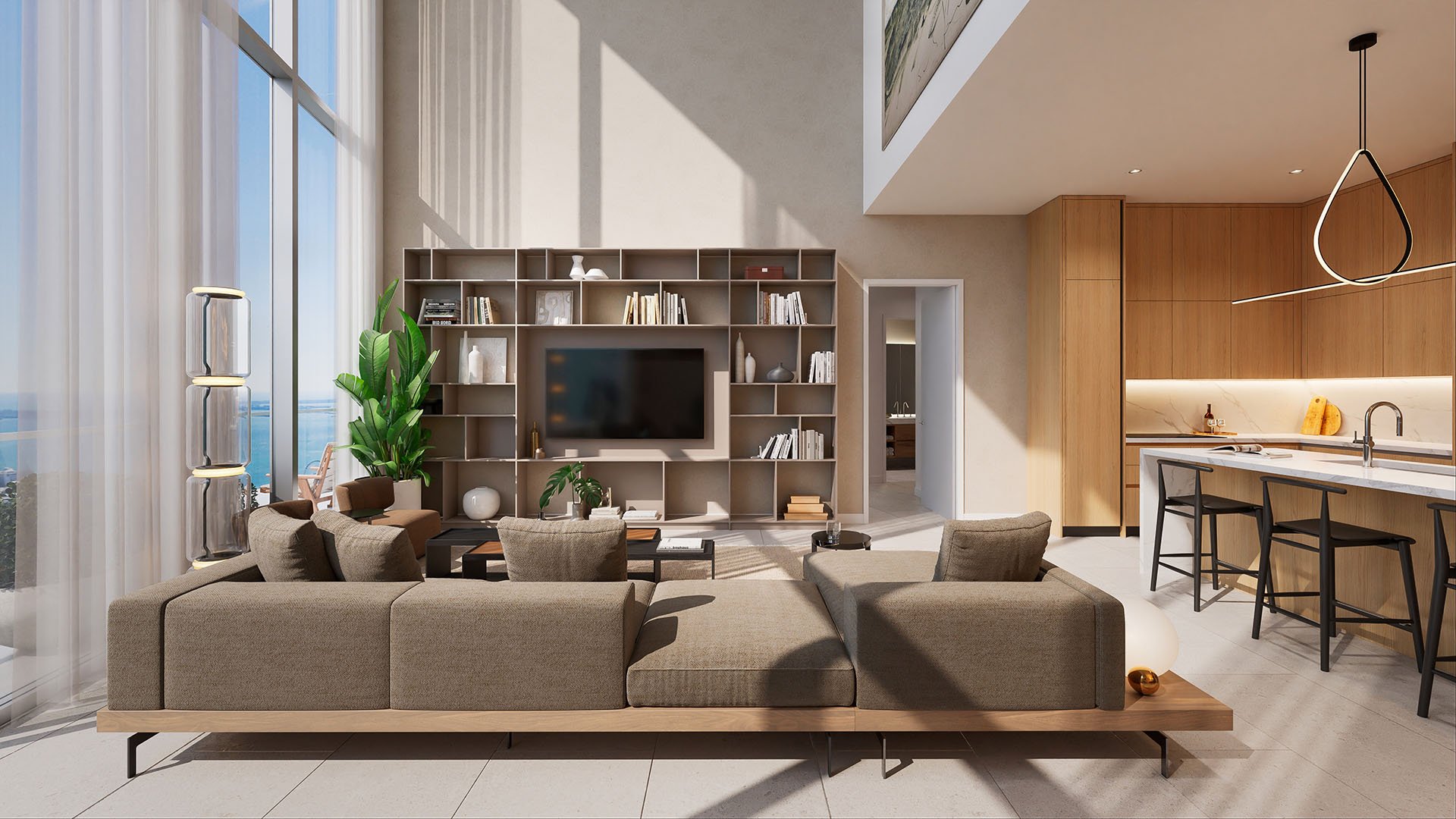 Casa Bella Downtown Miami sunlit living room with built-in library wall and adjacent modern kitchen, styled for luxury and ultra luxury preconstruction condos interiors in Downtown Miami.