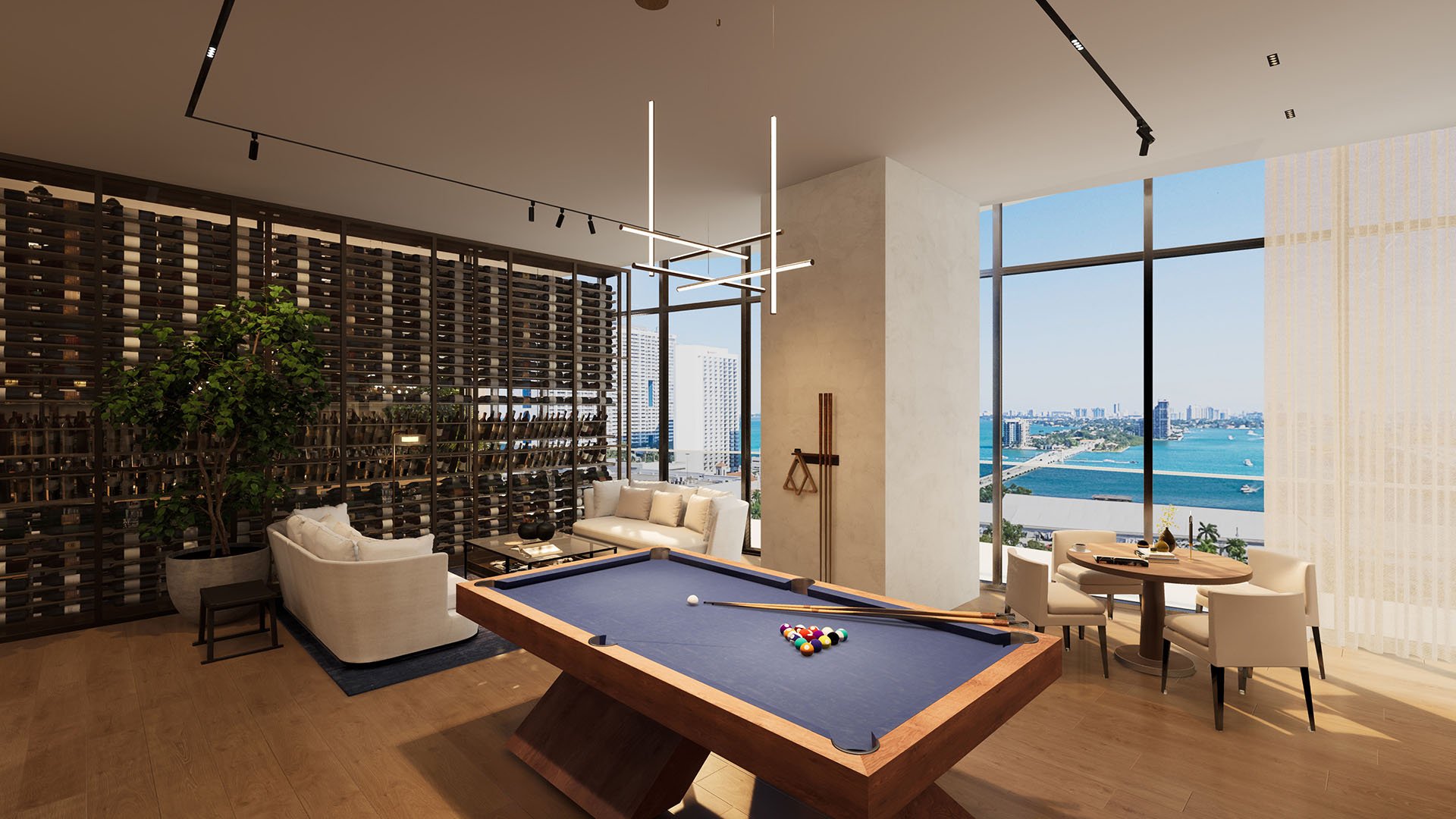 Casa Bella by B&B Italia Downtown Miami game lounge with pool table, wine display wall and seating, set against panoramic Biscayne Bay and skyline views, showcasing luxury and ultra luxury preconstruction condos amenities.