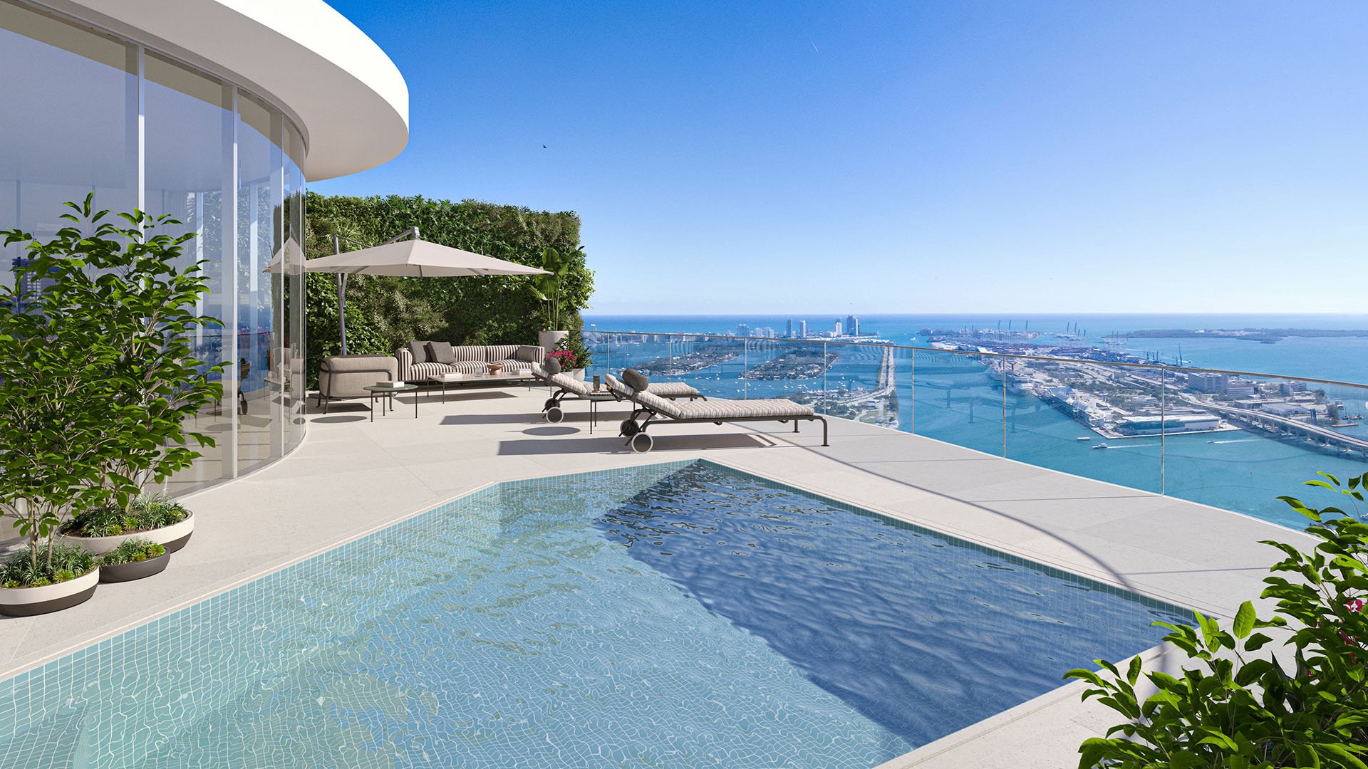 Casa Bella Downtown Miami rooftop pool deck with loungers and panoramic Biscayne Bay and ocean skyline views, highlighting luxury and ultra luxury preconstruction condos amenities in Miami.