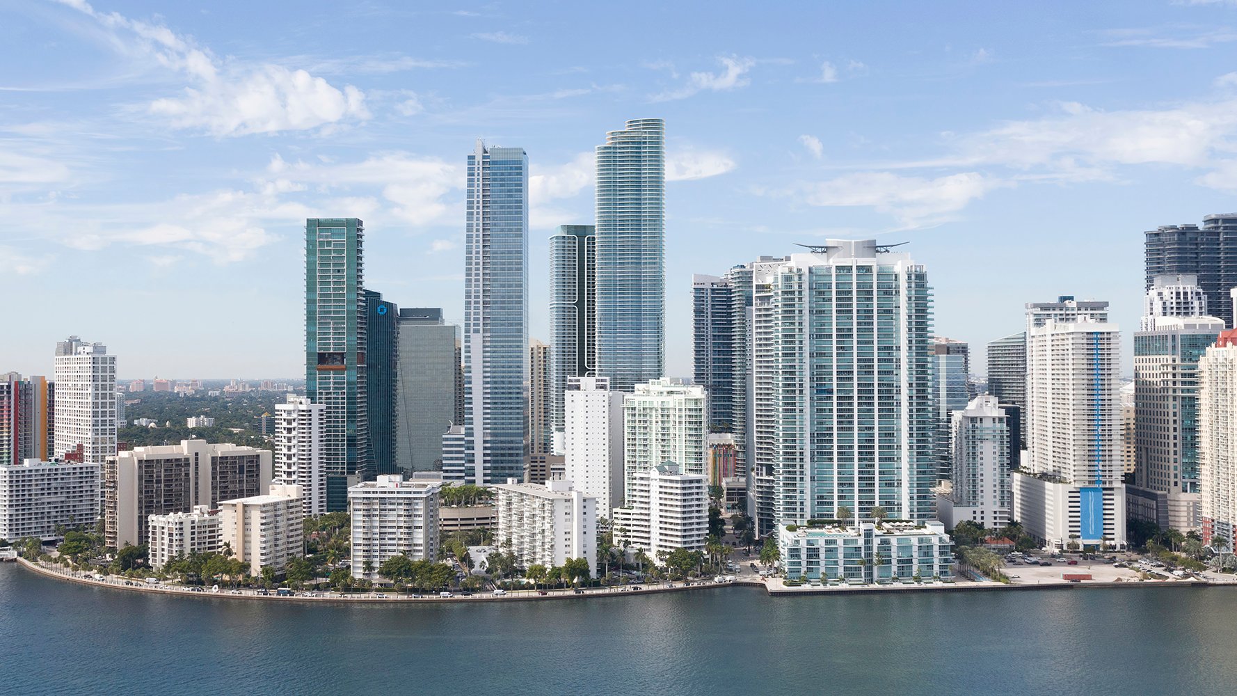 Cipriani Residences Brickell. Brickell, Miami aerial skyline along Biscayne Bay, financial district high‑rises and waterfront parks; sought‑after market for luxury and ultra luxury condos, with preconstruction and resale. Featuring view.