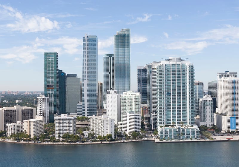 Cipriani Residences Brickell. Brickell, Miami aerial skyline along Biscayne Bay, financial district high‑rises and waterfront parks; sought‑after market for luxury and ultra luxury condos, with preconstruction and resale. Featuring view.