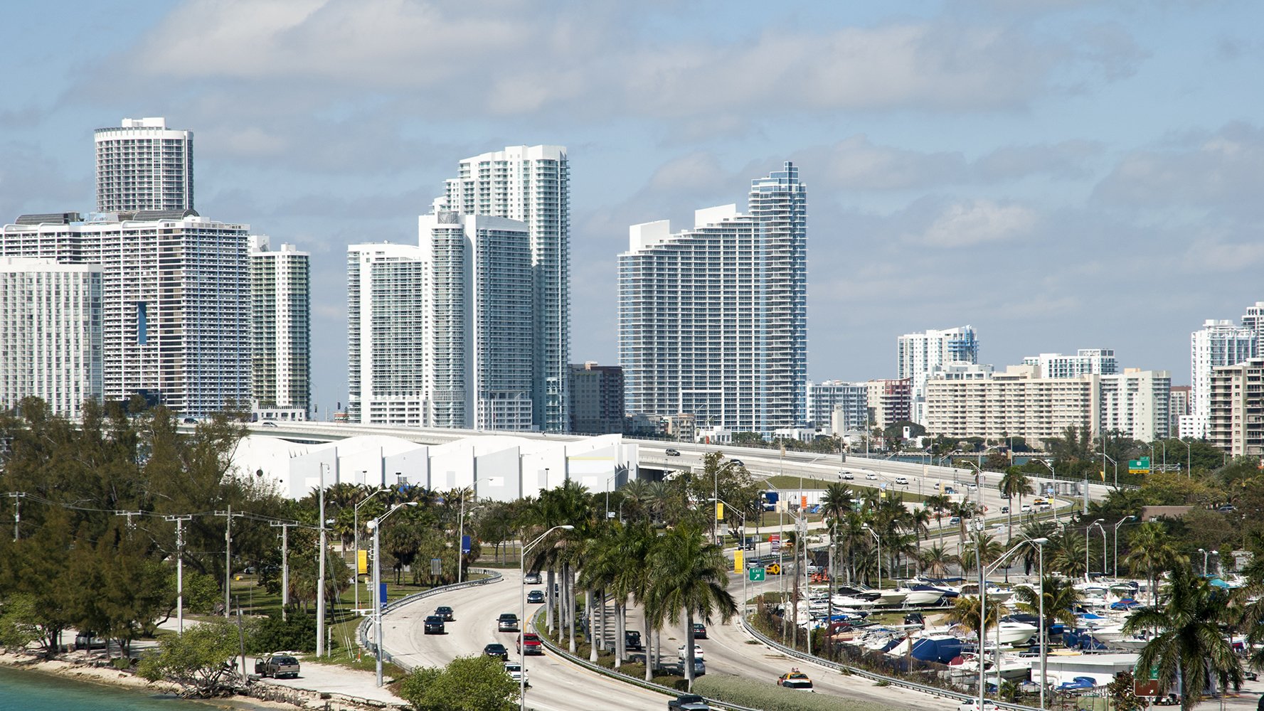 Miami cityscape with iconic skyline and high rises, prime market for luxury and ultra luxury condos, including preconstruction and resale.