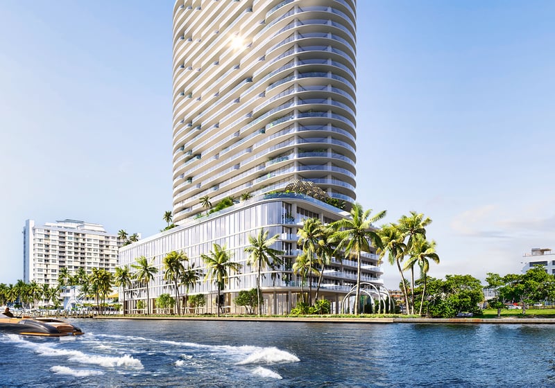 Waterfront exterior of the curved condo tower with a speedboat on the bay at Continuum Club and Residences in North Bay Village, a preconstruction luxury and ultra luxury condos development with a prominent marina-facing presence.