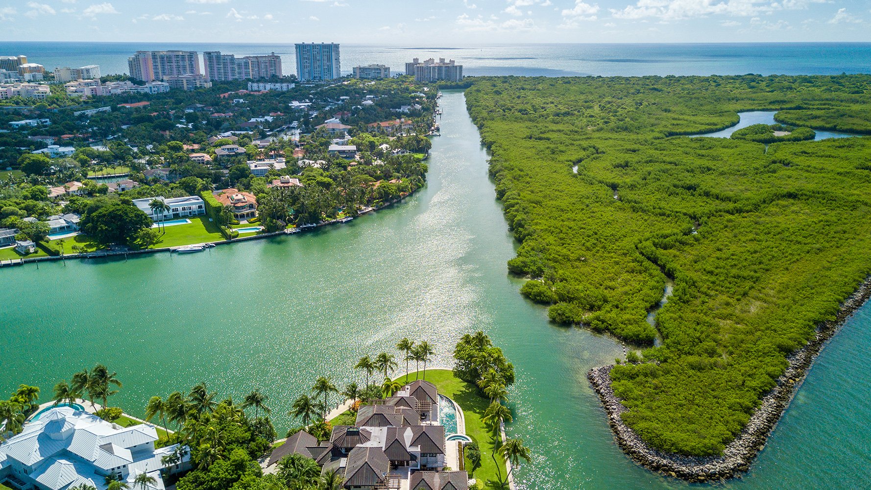 Coral Gables coastal aerial over residential waterways and yachts, desirable South Florida location for luxury and ultra luxury condos, with preconstruction and resale. Featuring view and waterway.