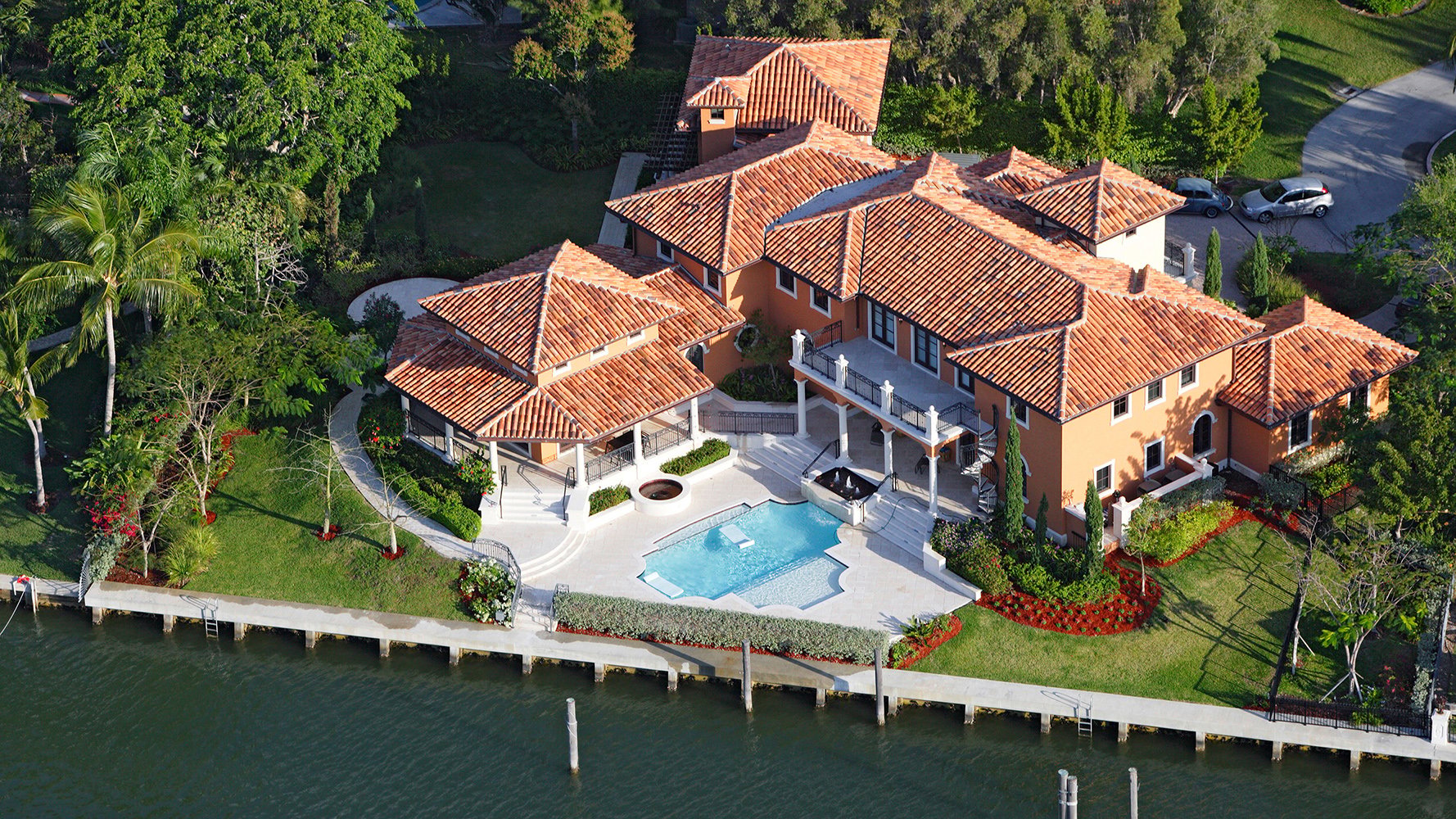Aerial of Coral Gables luxury waterfront home on canal - yachting lifestyle near luxury and ultra luxury condos, with preconstruction and resale.