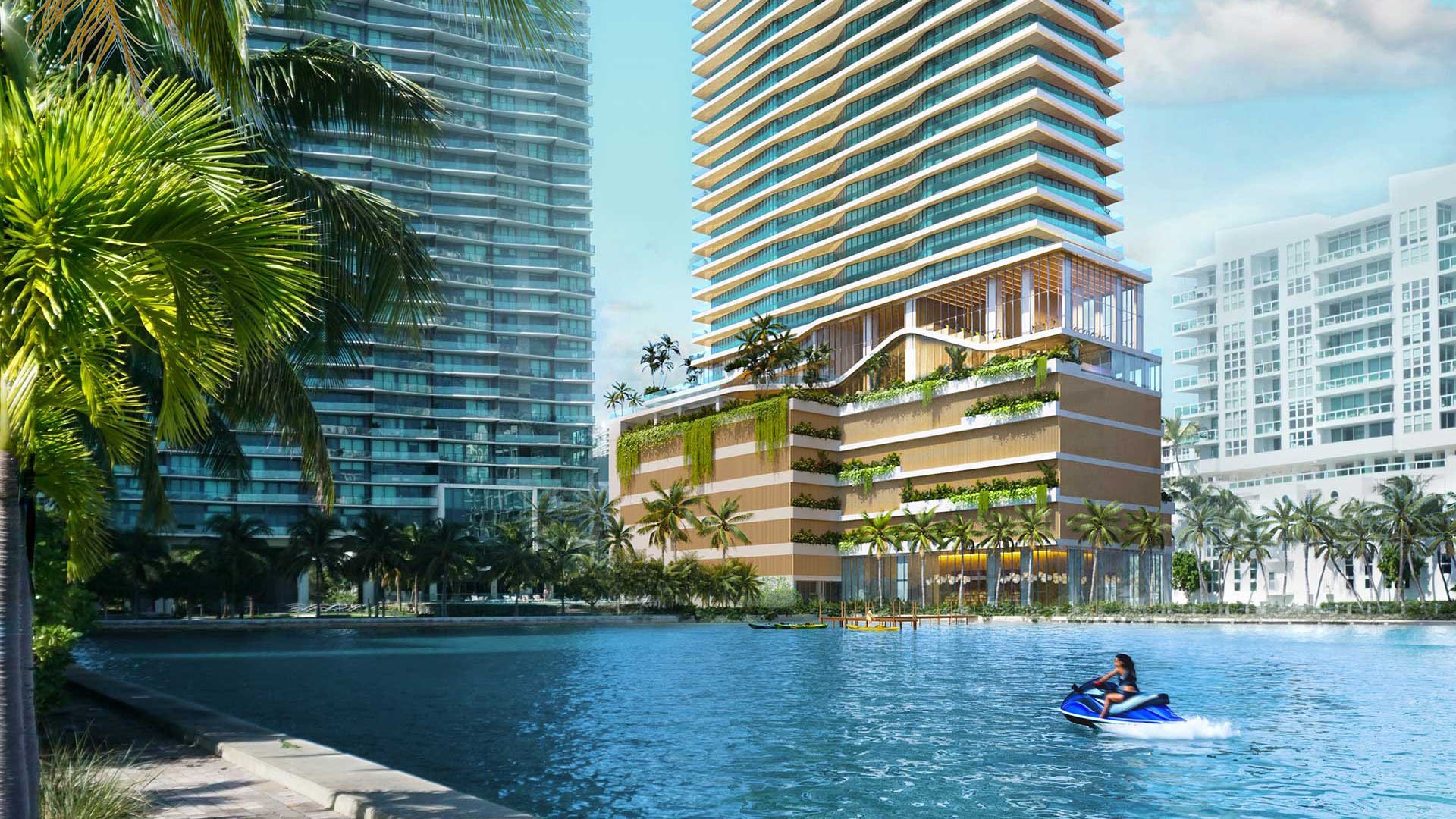 Cove Miami in Miami presents luxury and ultra luxury condos in preconstruction, featuring a waterfront condo exterior rising above the bay, with a jet ski in the foreground and neighboring towers.