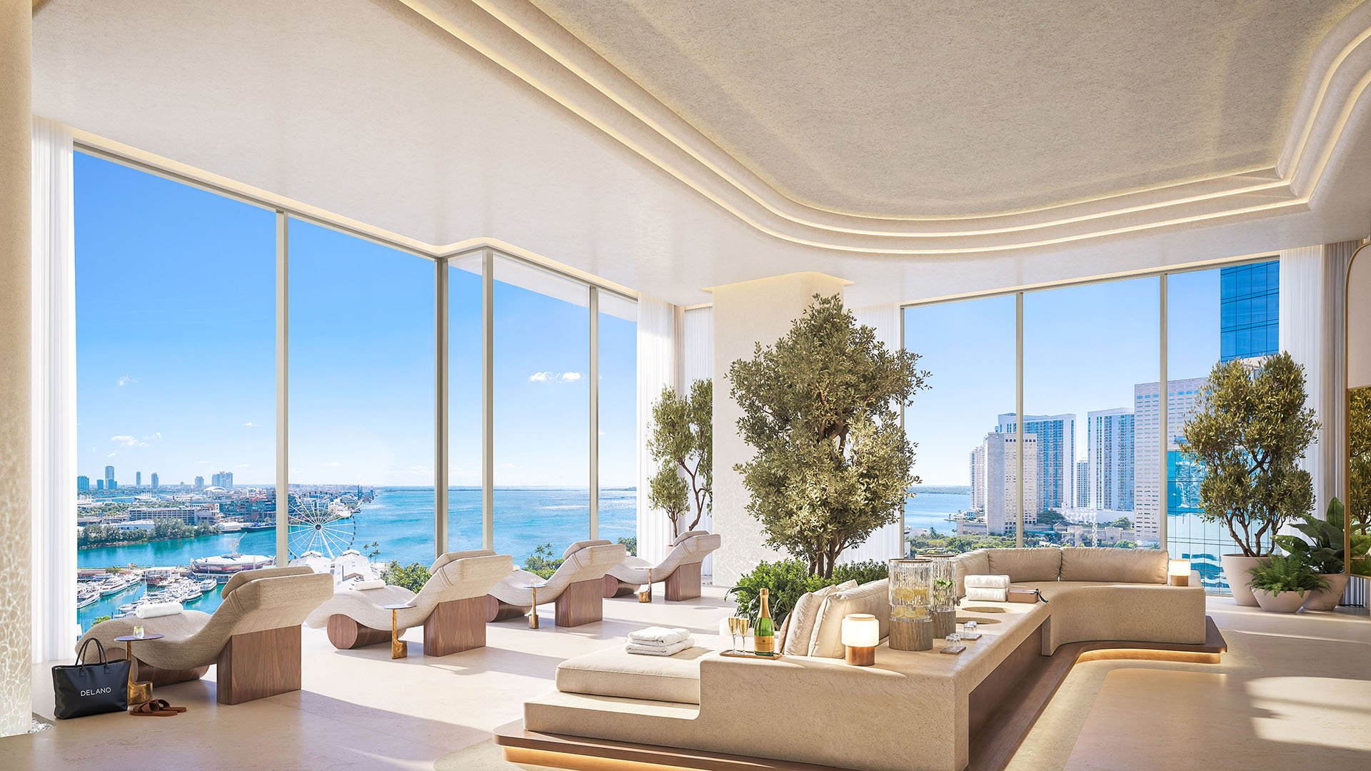 Spa lounge at Delano Residences & Hotel, Miami, with chaise seating, indoor trees, floor-to-ceiling windows, and waterfront views, showing luxury and ultra luxury preconstruction condos.