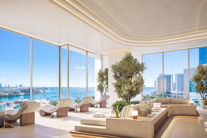 Spa lounge at Delano Residences & Hotel, Miami, with chaise seating, indoor trees, floor-to-ceiling windows, and waterfront views, showing luxury and ultra luxury preconstruction condos.