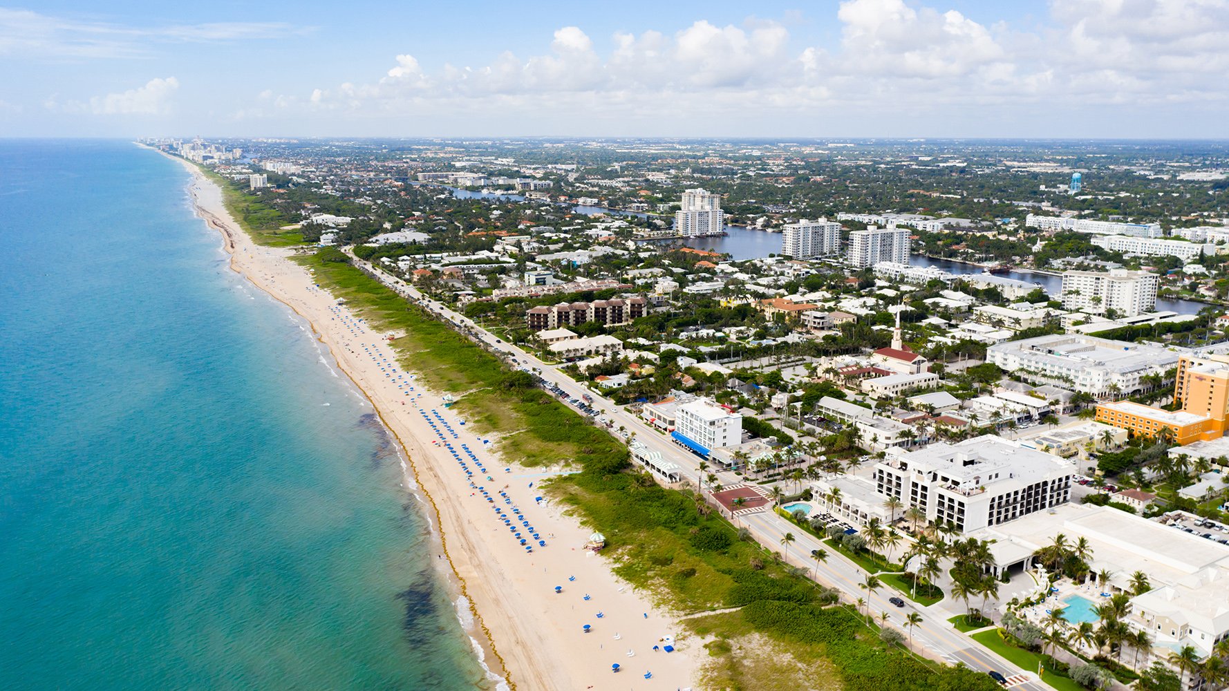 Delray Beach, Florida aerial of beachfront cityscape and Atlantic shoreline, vibrant area for luxury and ultra luxury condos; preconstruction and resale.