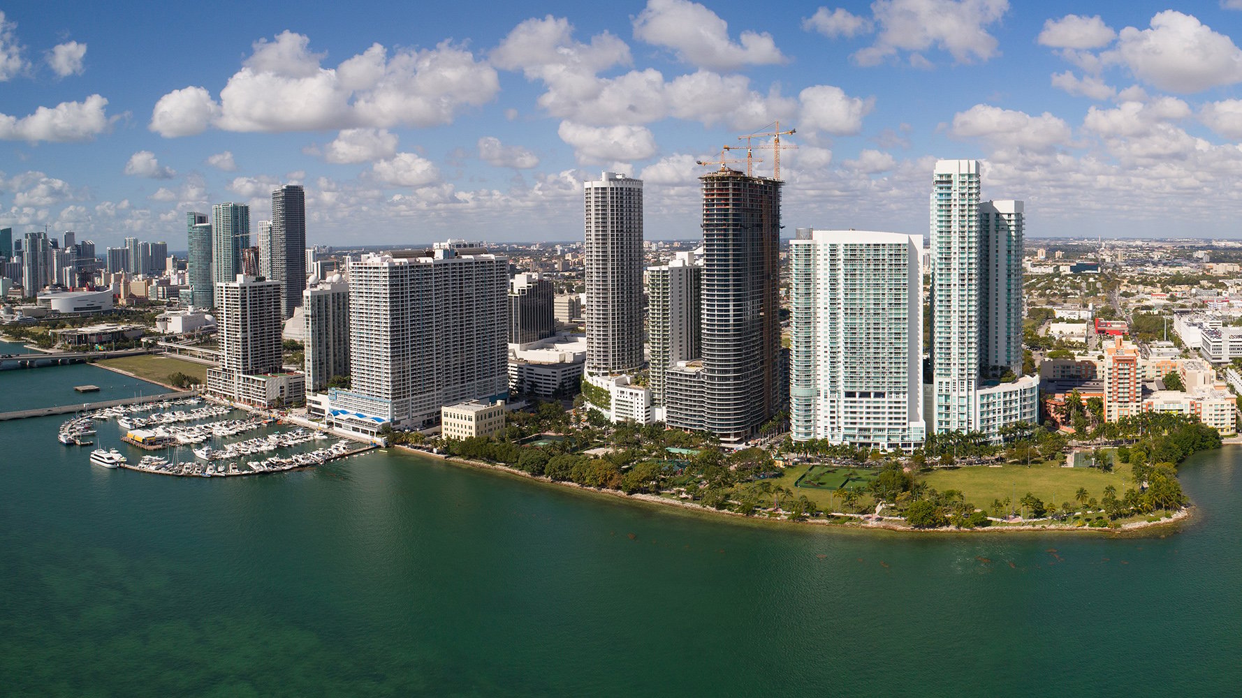 Edgewater, Miami panoramic aerial of waterfront towers on Biscayne Bay, destination for luxury and ultra luxury condos, with preconstruction and resale options. Featuring skyline view.
