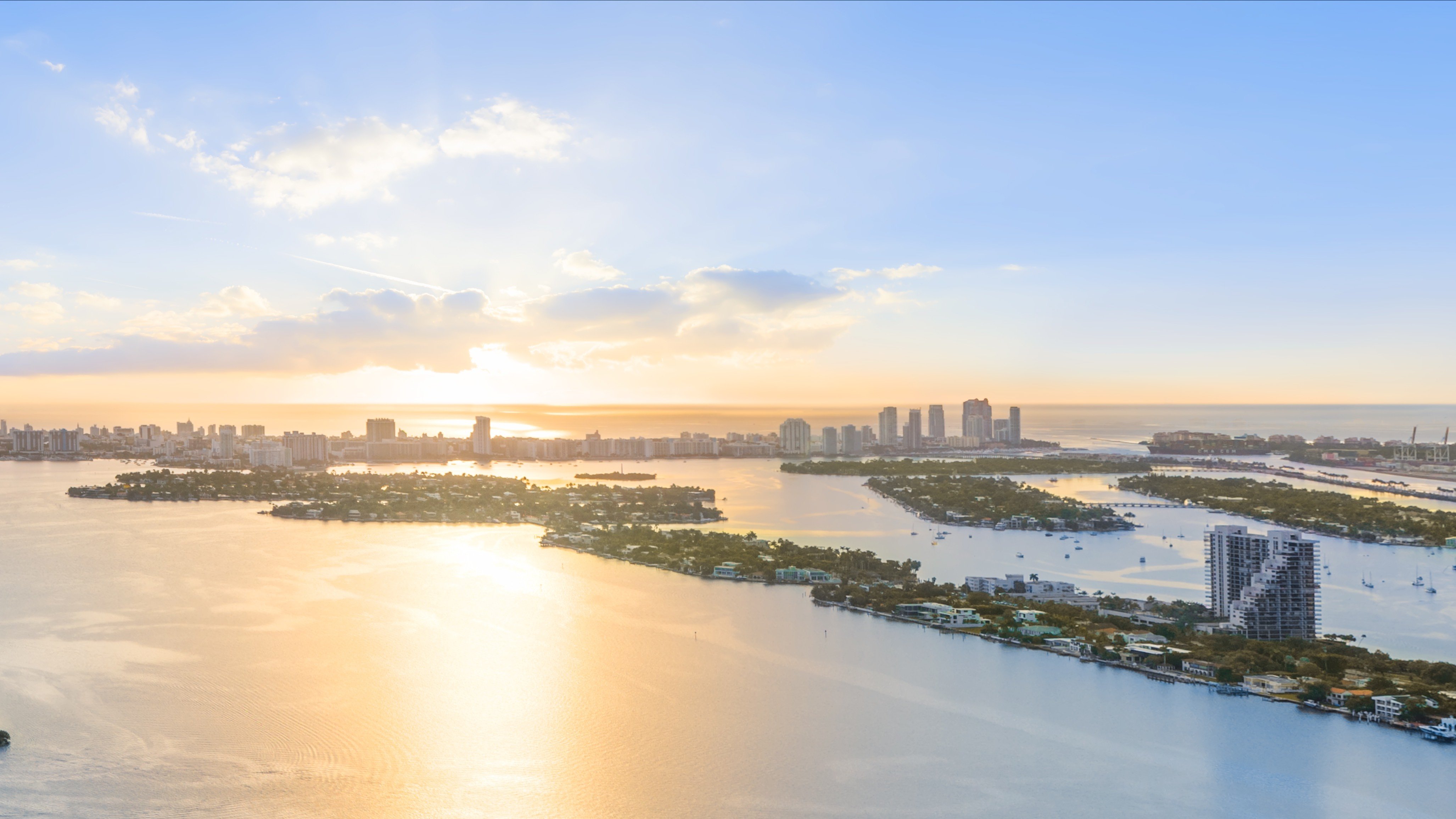 Edition Edgewater, Miami sunset over waterfront cityscape. Edgewater skyline vistas from luxury and ultra luxury condos; preconstruction.