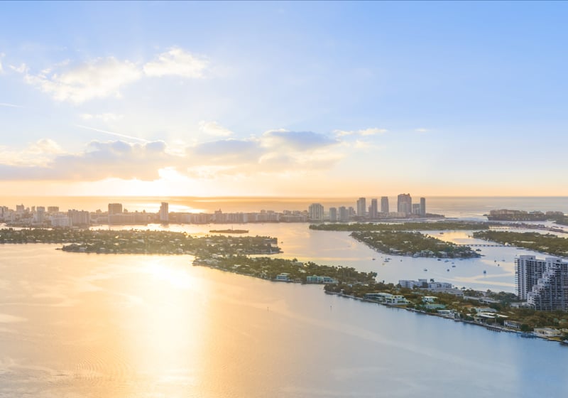 Edition Edgewater, Miami sunset over waterfront cityscape. Edgewater skyline vistas from luxury and ultra luxury condos; preconstruction.