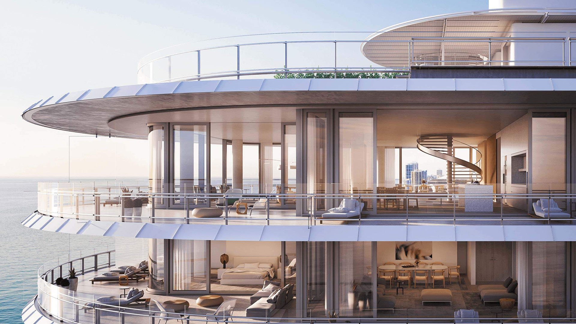 Eighty Seven Park, Miami Beach luxury and ultra luxury condos upper-level oceanfront terraces with double-height glass, expansive balconies, and a sculptural spiral staircase.