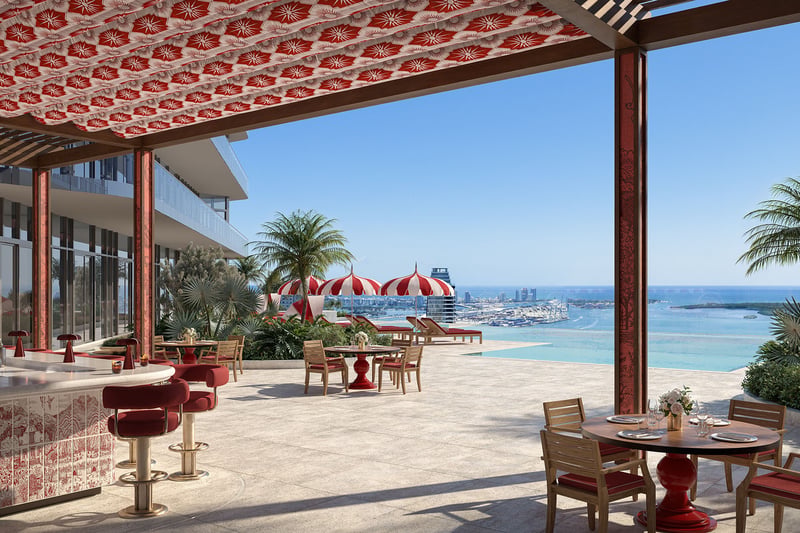 Faena Residences Miami Beach rooftop terrace with outdoor bar, dining tables and panoramic waterfront views, Downtown Miami. Luxury and ultra luxury preconstruction condos featuring elevated entertaining and hospitality spaces.