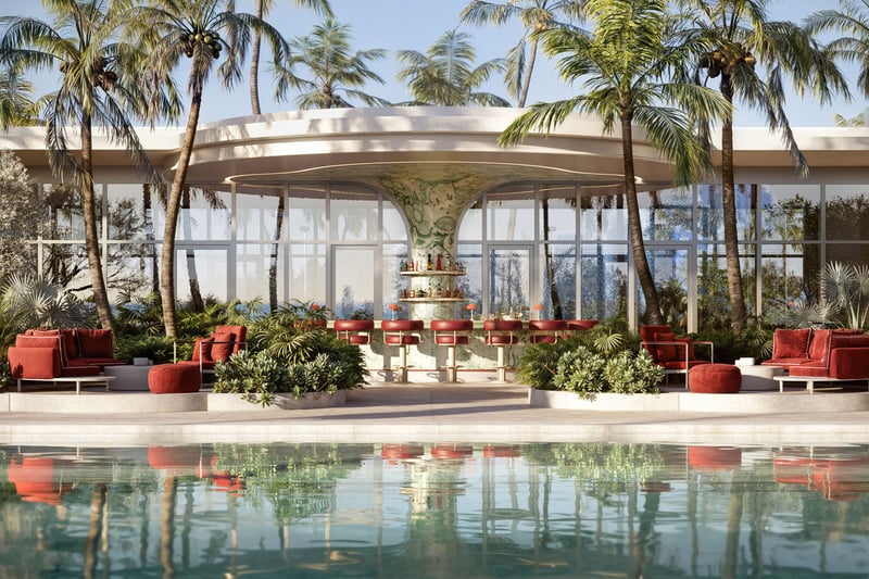 Faena Residences Miami Level 11 pool terrace with palm trees, juice bar and red lounge seating overlooking the bay, Downtown Miami. Luxury and ultra luxury preconstruction condos with sky-deck pool amenities.