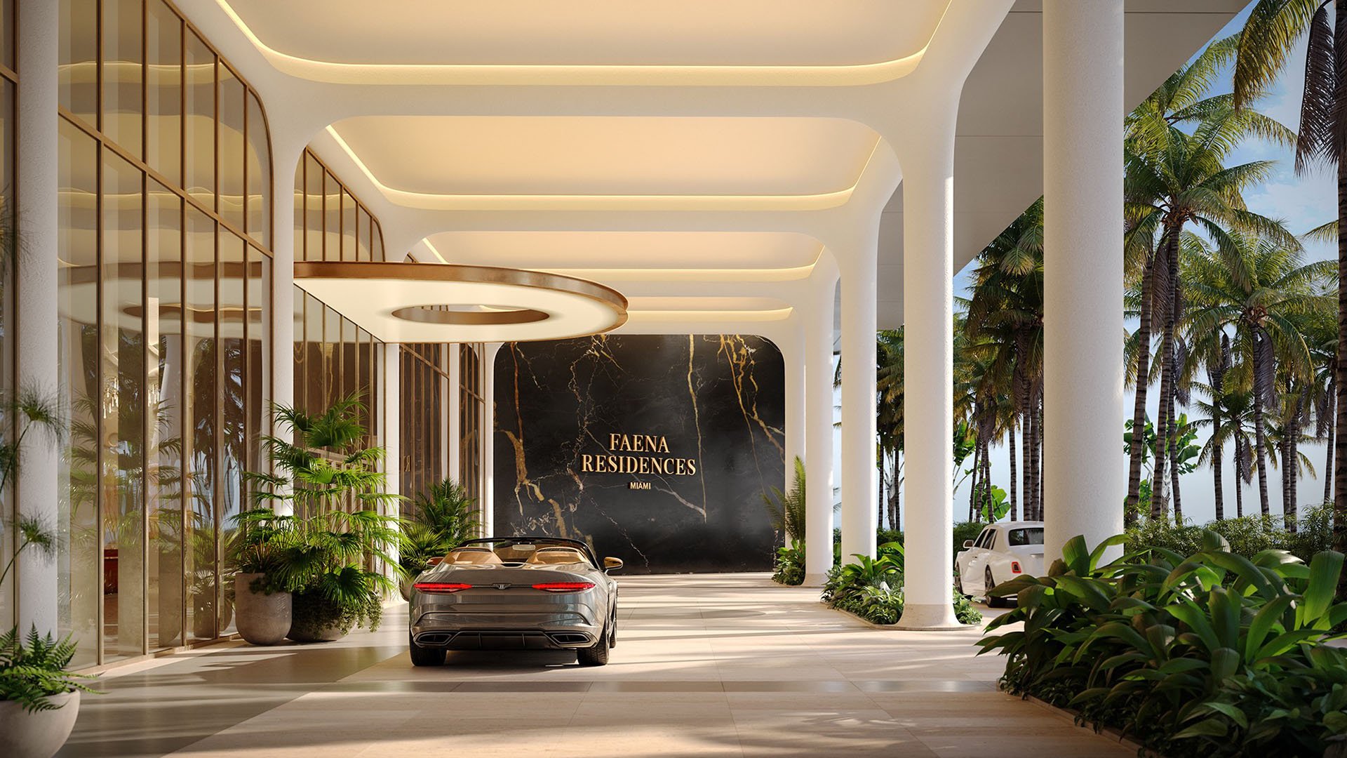 Faena Residences Miami porte cochere arrival drive with white columns, Faena entry signage and tropical landscaping, Downtown Miami. Luxury and ultra luxury preconstruction condos with secure, elegant drop-off.