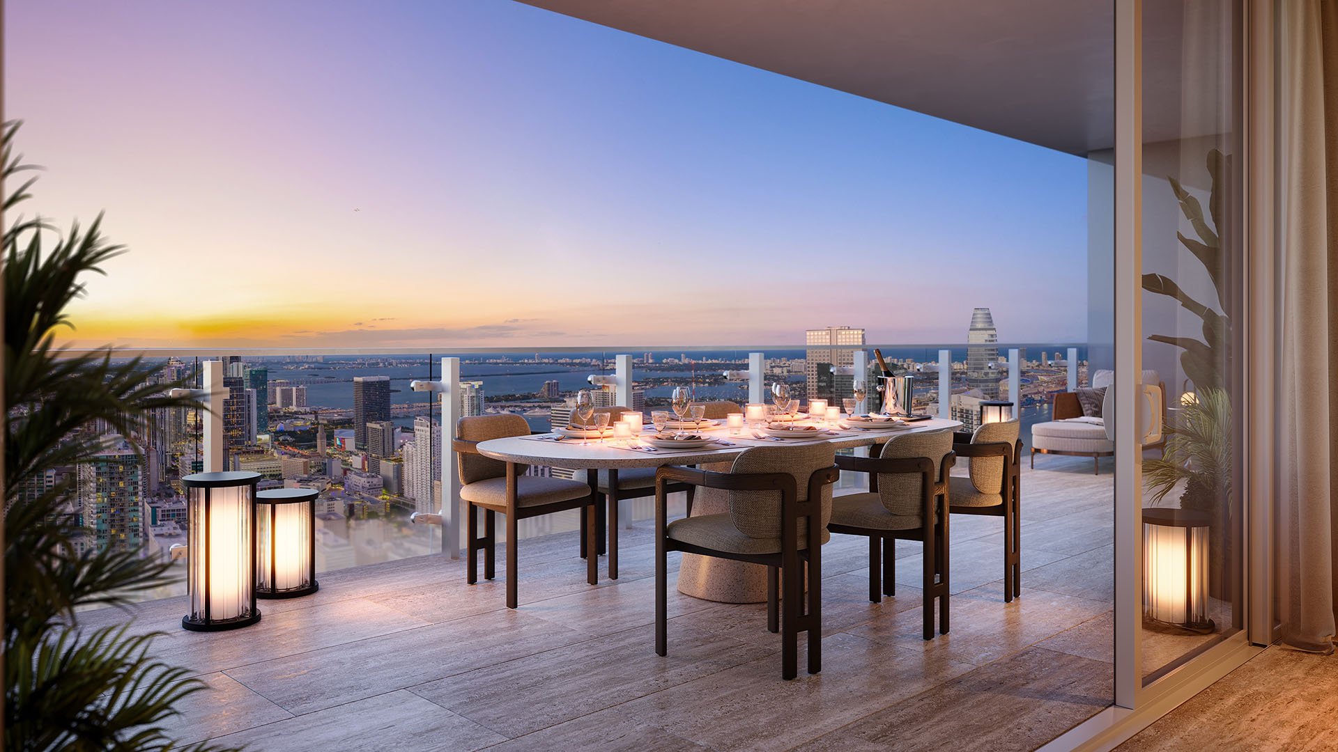 Faena Residences Miami private terrace with candlelit outdoor dining, sunset skyline and Biscayne Bay views, Downtown Miami. Luxury and ultra luxury preconstruction condos designed for indoor-outdoor entertaining.