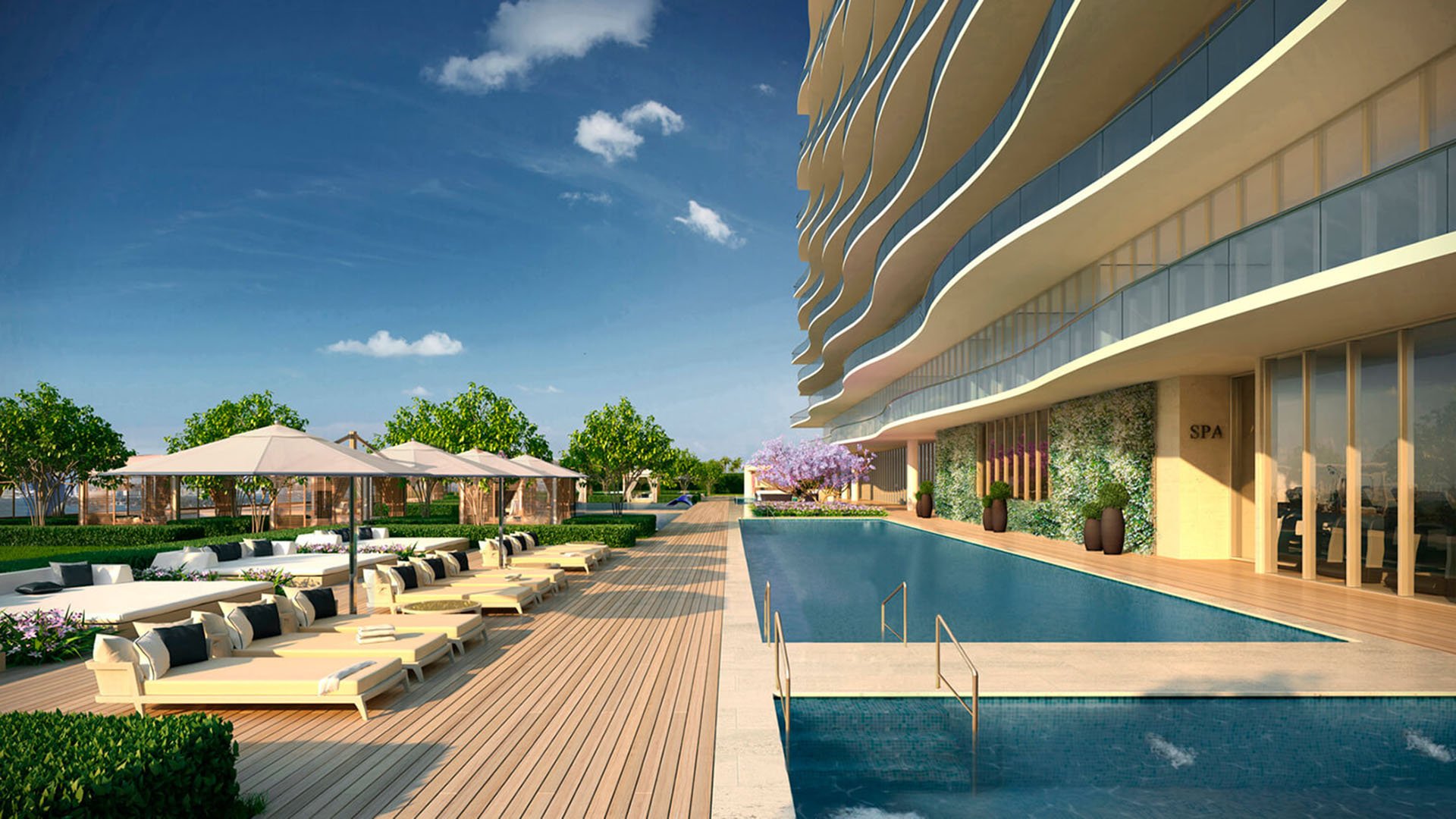 Spa-side pool deck at Fendi Chateau Residences in Surfside with chaise lounges, umbrella seating, and a long lap-style pool for luxury and ultra luxury condos.