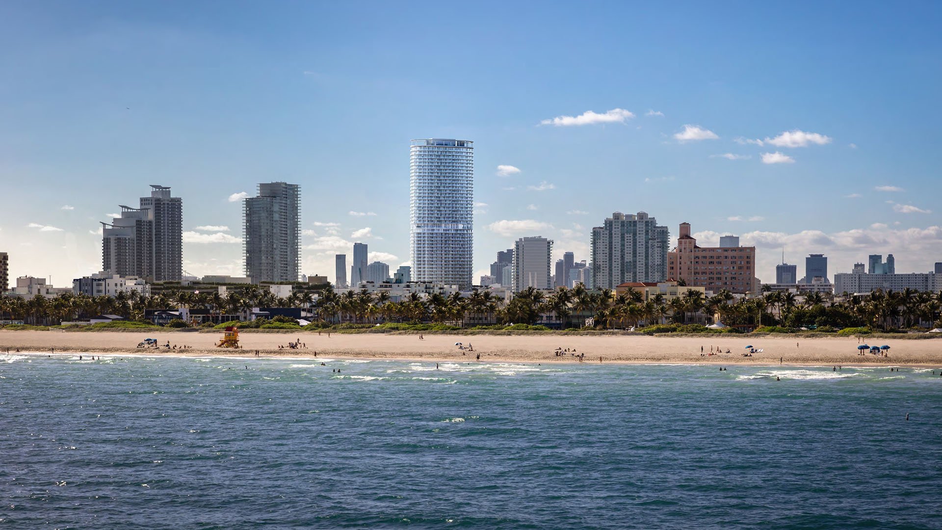 Beachfront skyline view of the Five Park tower in Miami Beach, luxury and ultra luxury condos seen from the water with sand and coastal high rises.