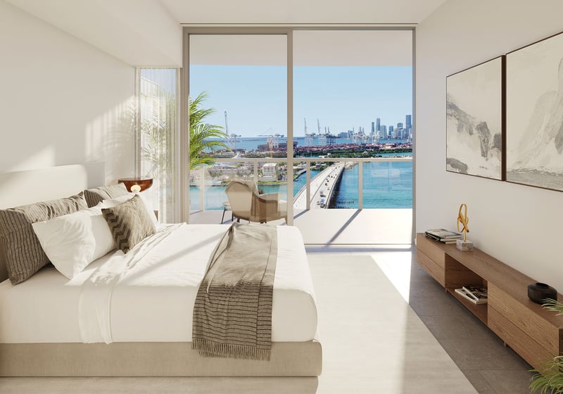 Bedroom facing a bay, bridge and skyline view at Five Park in Miami Beach, luxury and ultra luxury condos with a private balcony and floor to ceiling glass.