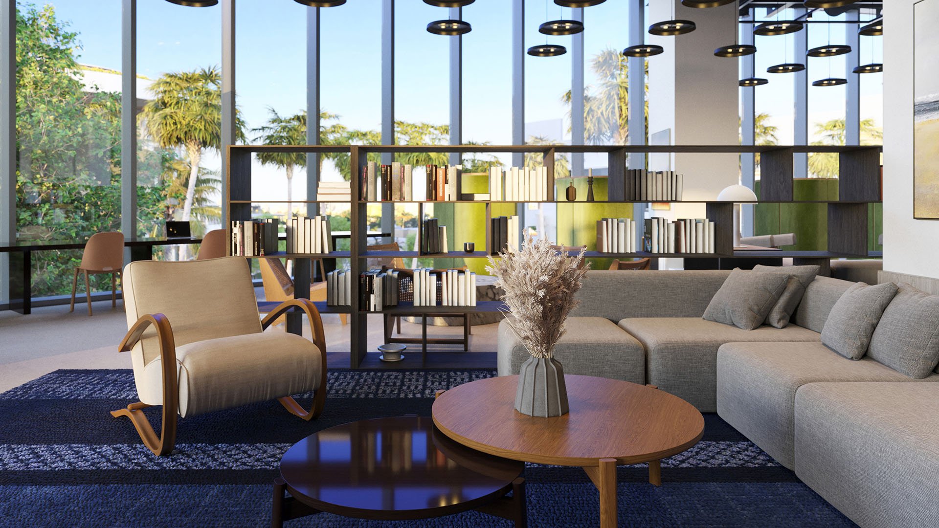 Coworking lounge at Five Park in Miami Beach, luxury and ultra luxury condos with bookshelves, soft seating, large windows and a relaxed library atmosphere.