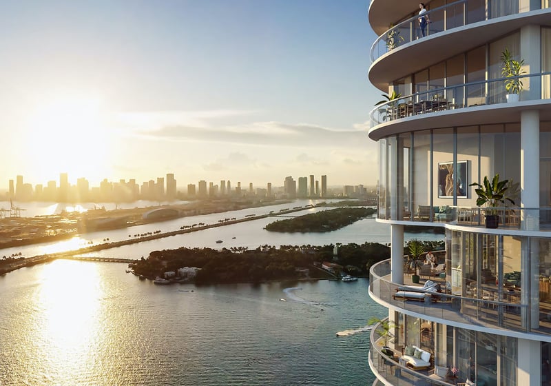 Tower edge and rounded balconies at Five Park in Miami Beach, luxury and ultra luxury condos with a sweeping sunset water view and skyline across the bay.