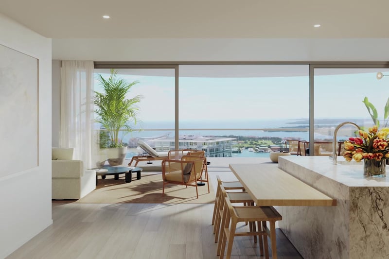 Entry view into the kitchen and terrace at Five Park in Miami Beach, luxury and ultra luxury condos with water views and a marble island.