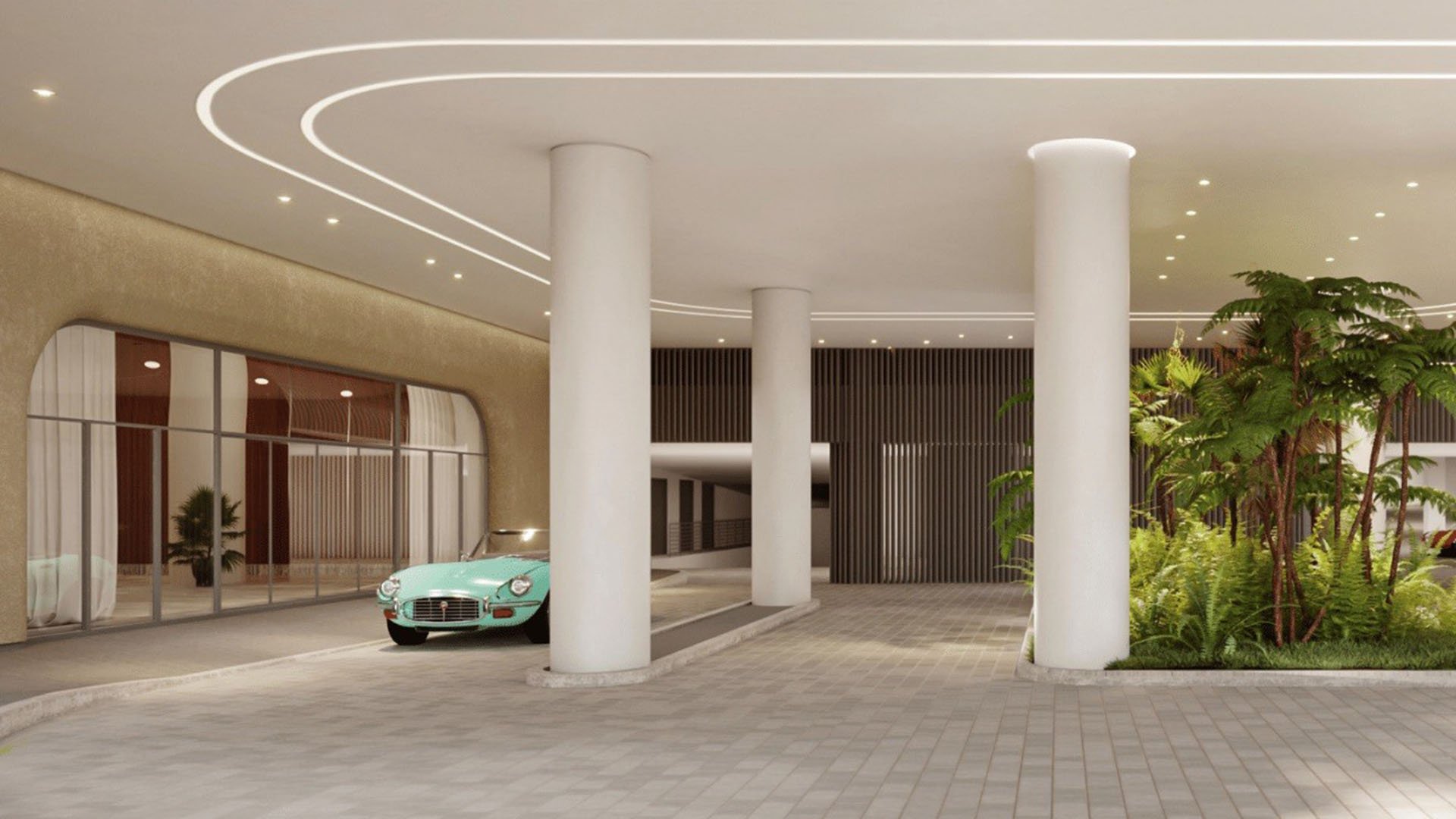 Grand columned arrival court at Five Park in Miami Beach, luxury and ultra luxury condos with a porte cochere, soft lighting and landscaped entry.