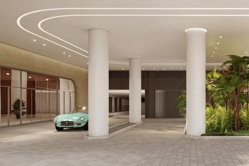 Grand columned arrival court at Five Park in Miami Beach, luxury and ultra luxury condos with a porte cochere, soft lighting and landscaped entry.