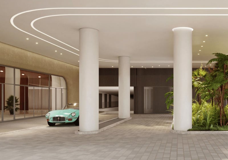 Grand columned arrival court at Five Park in Miami Beach, luxury and ultra luxury condos with a porte cochere, soft lighting and landscaped entry.