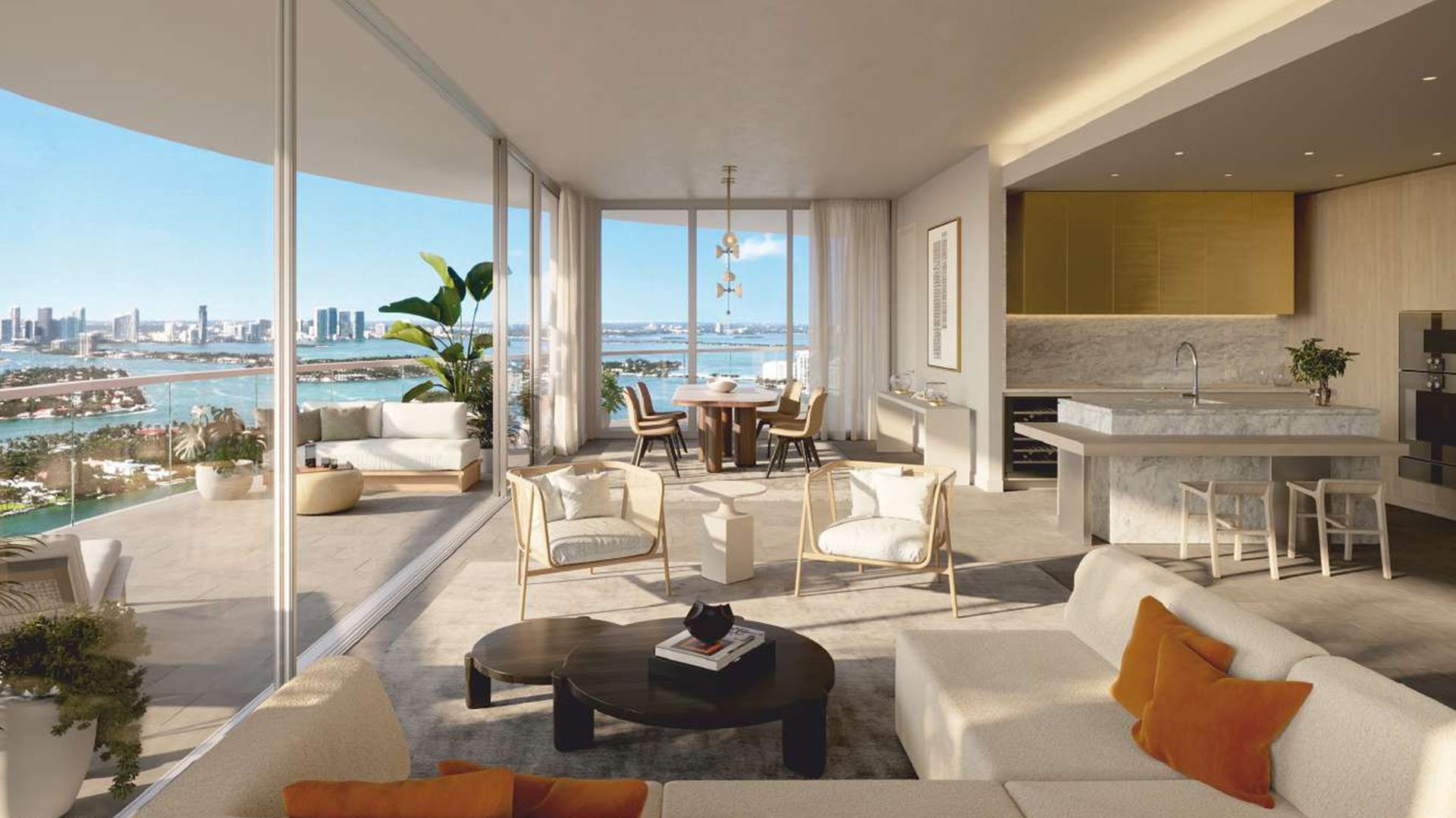 Great room with bay views and an open kitchen at Five Park in Miami Beach, luxury and ultra luxury condos with rounded balcony lines and soft light.