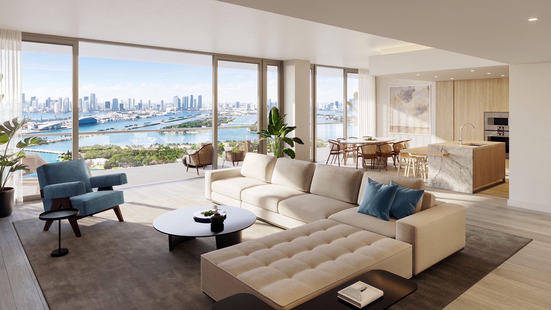 Large living room with skyline views at Five Park in Miami Beach, luxury and ultra luxury condos connected to an open kitchen and dining area.