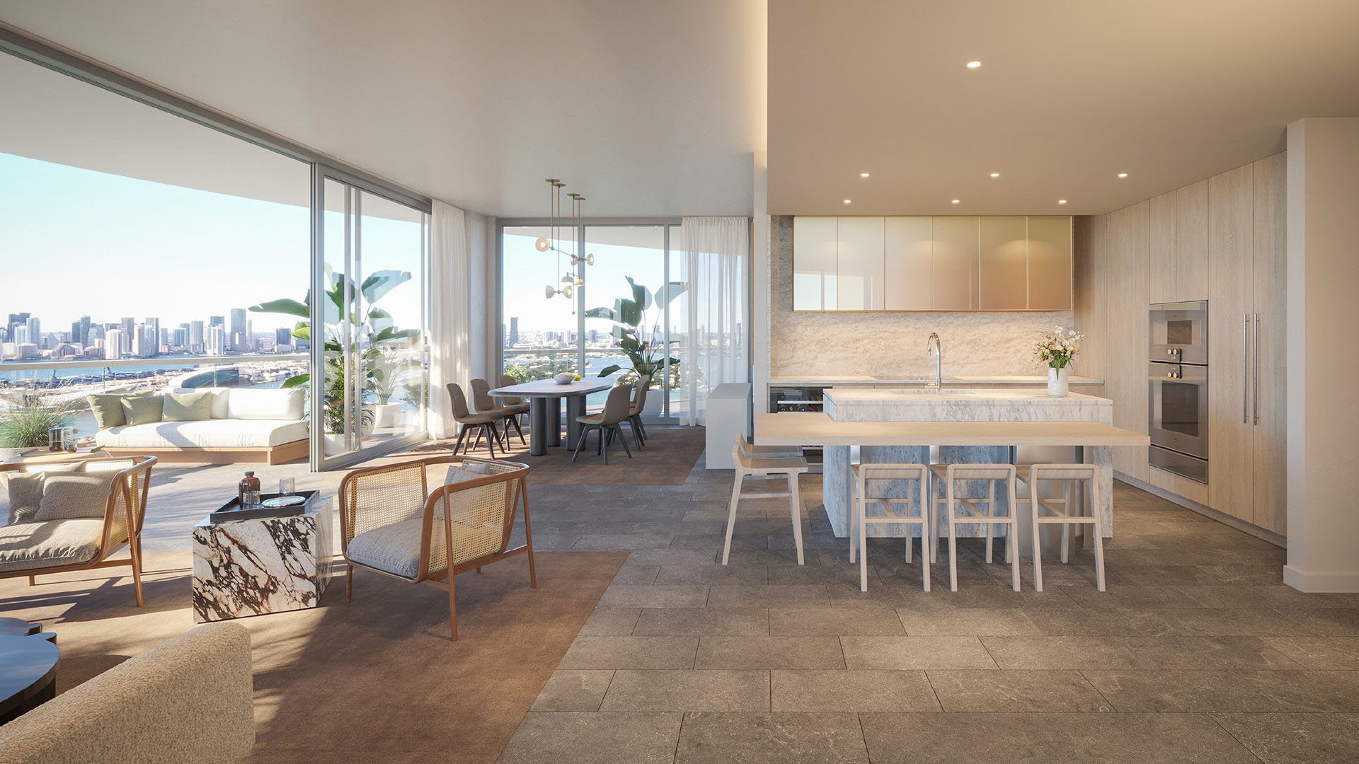 Open kitchen lounge at Five Park in Miami Beach, luxury and ultra luxury condos with a terrace, bay skyline views and a large marble island.