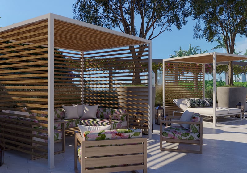 Pool deck cabanas at Five Park in Miami Beach, luxury and ultra luxury condos with wood pergolas, cushioned loungers and a resort style outdoor lounge.
