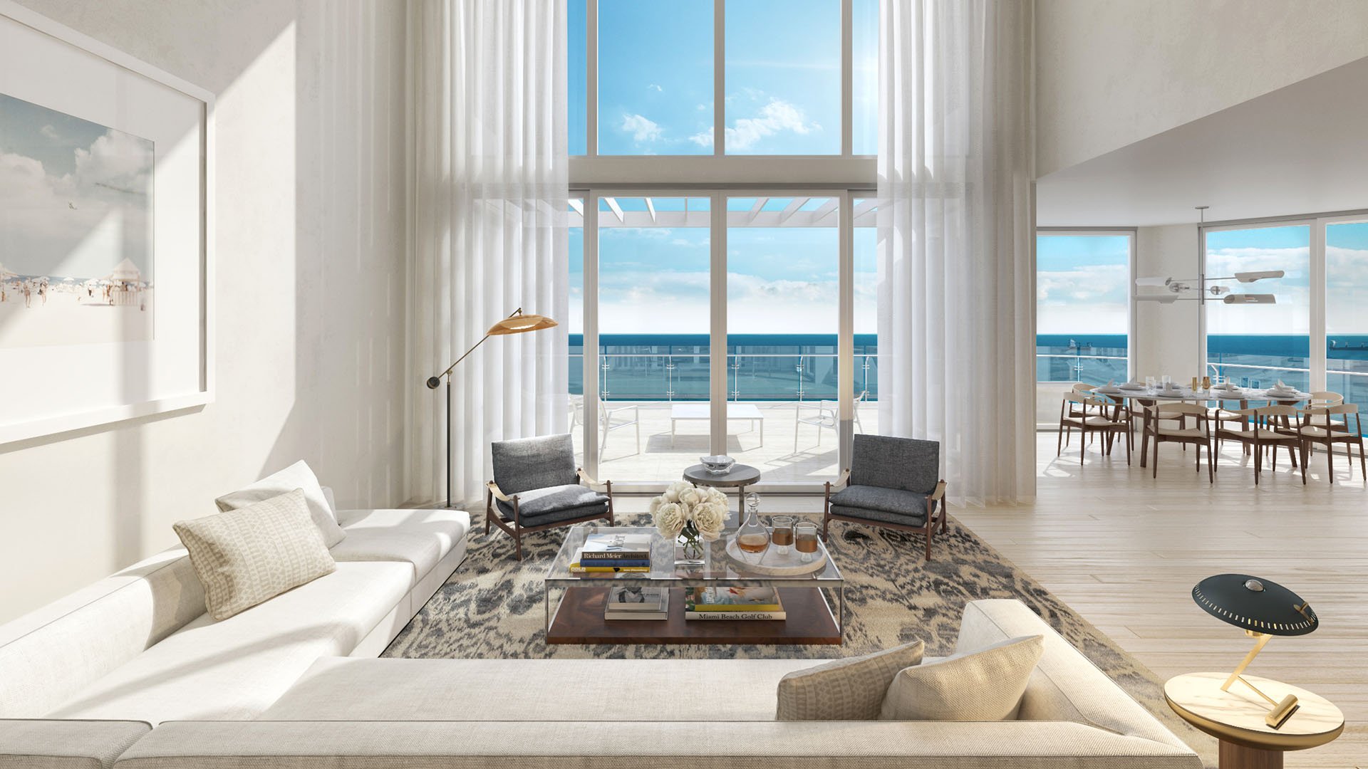 Double-height great room with an ocean terrace and adjacent dining area at Four Seasons Residences Fort Lauderdale in Fort Lauderdale, illustrating luxury and ultra luxury condos with expansive indoor-outdoor living.