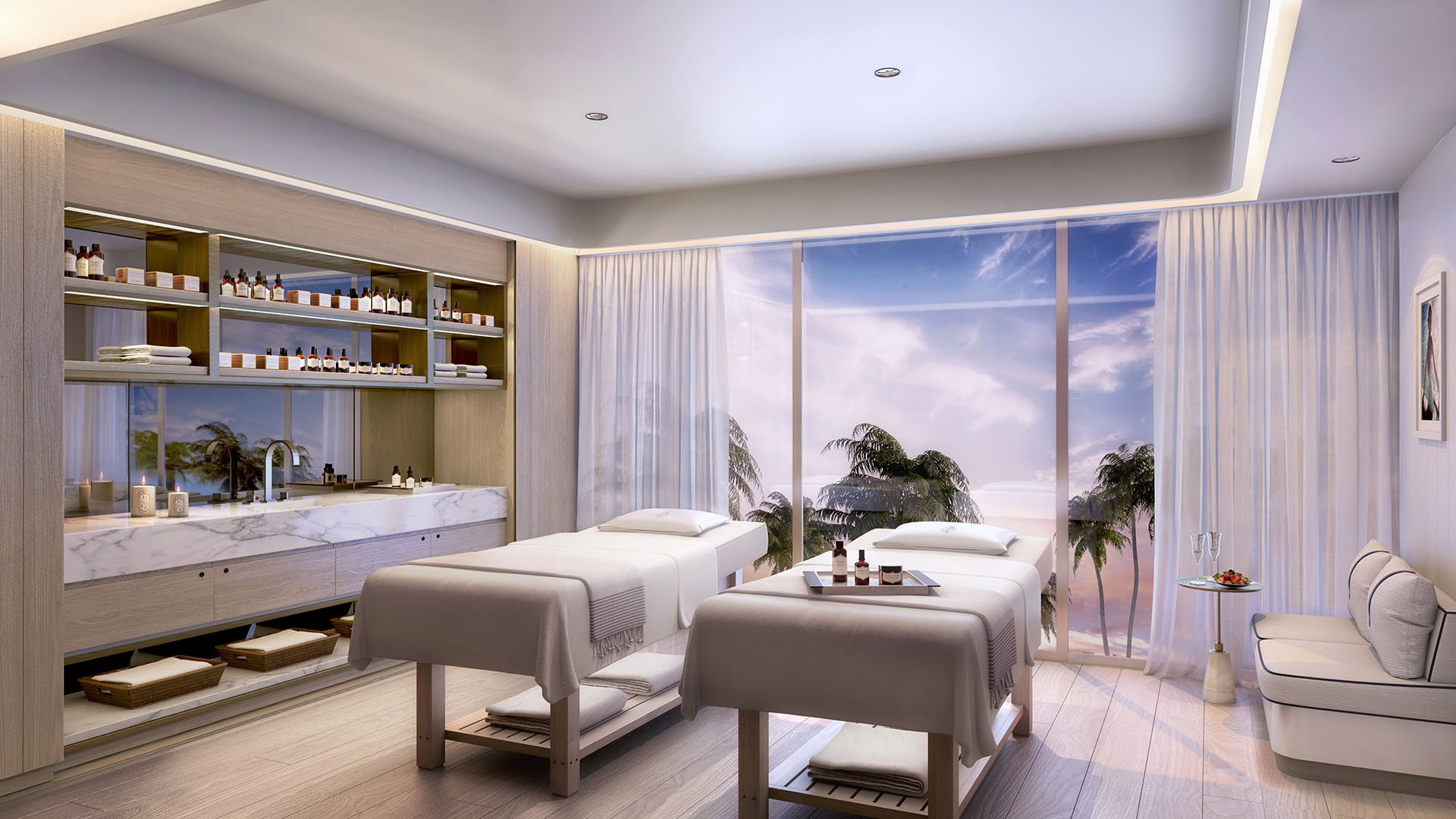 Double spa treatment room with twin massage tables and palm-framed water views at Four Seasons Residences Fort Lauderdale in Fort Lauderdale, showcasing luxury and ultra luxury condos with serene wellness amenities.