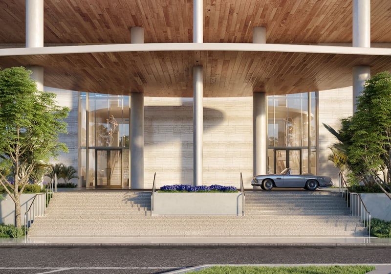 Grand porte cochere entrance with broad steps, tall glass walls, and a classic convertible at Four Seasons Residences Fort Lauderdale in Fort Lauderdale, introducing luxury and ultra luxury condos with a grand arrival.